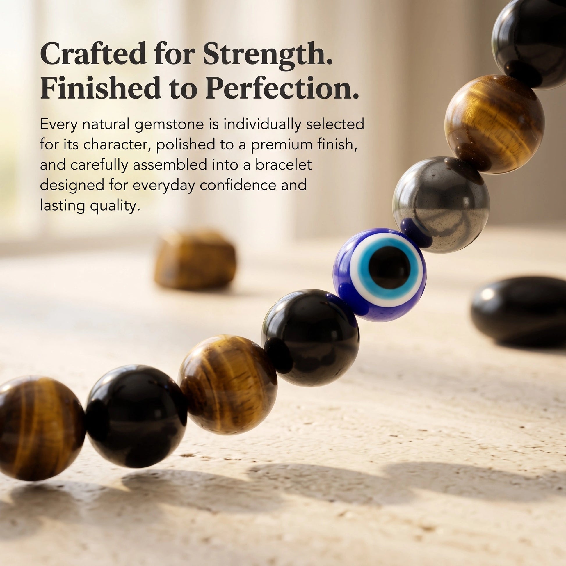 Close-up of the Triple Protection Bracelet showcasing natural Black Onyx, Tiger Eye, Hematite and Evil Eye bead with premium polished finish.
